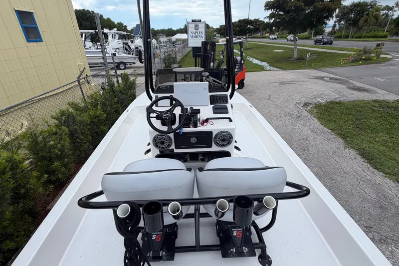 Slide: The Image of 2022 SCB S22 boat interior with steering console and seating at Naples Marina. - 10
