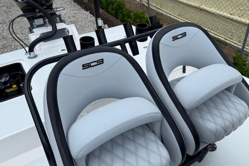 Slide: The Image of SCB S22 2022 boat seats with sleek design and diamond-pattern upholstery. - 11