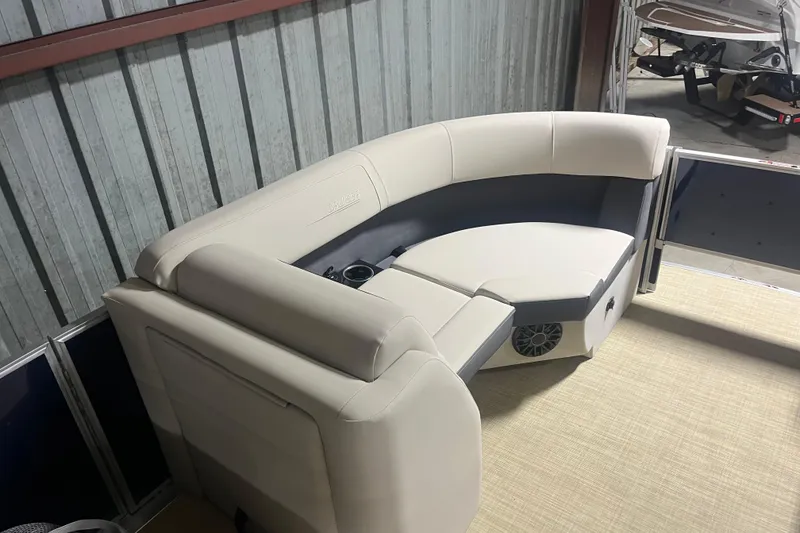 Slide: The Image of 2026 Harris Cruiser 210 FC boat interior with beige seating and cup holders. - 5