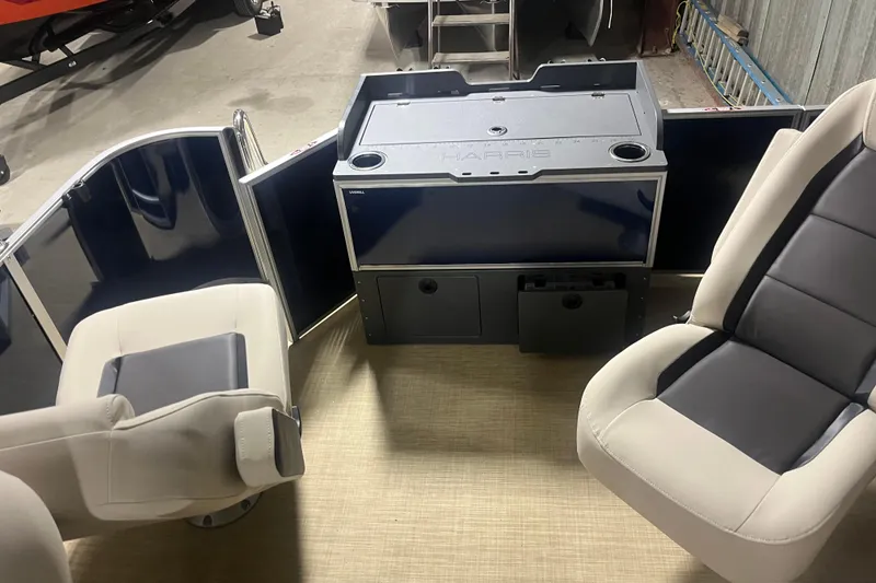 Slide: The Image of Interior of 2026 Harris Cruiser 210 FC boat with seating and storage compartments. - 8