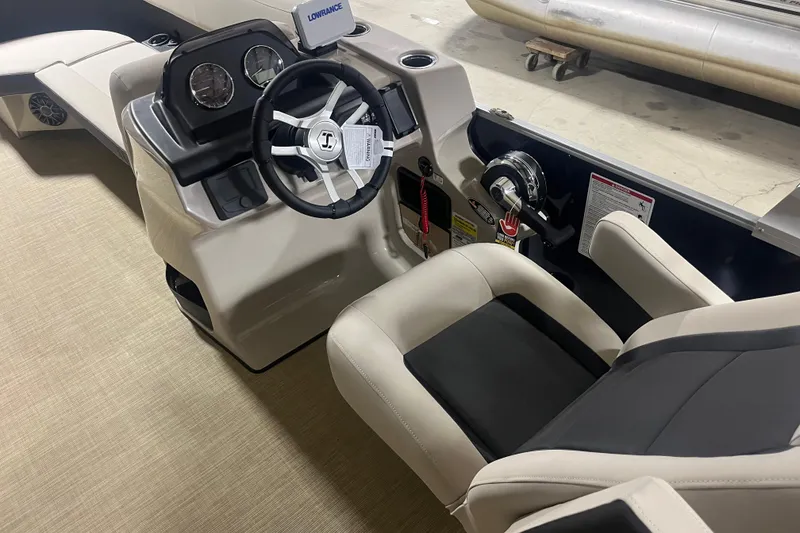 Slide: The Image of 2026 Harris Cruiser 210 FC boat interior with steering wheel and control panel. - 3