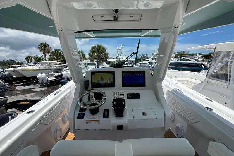 Slide: The Image of Cockpit view of 2025 Intrepid 375 Nomad SE boat with advanced navigation system. - 28