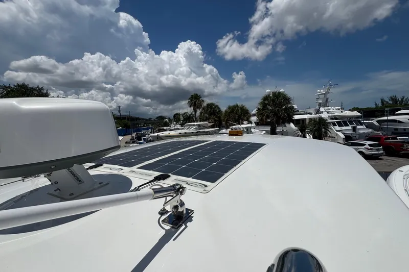 Slide: The Image of Rooftop view of 2025 Intrepid 375 Nomad SE with solar panels under a cloudy sky. - 33