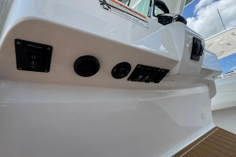 Slide: The Image of Control panel on 2025 Intrepid 375 Nomad SE boat, featuring windlass switch. - 26