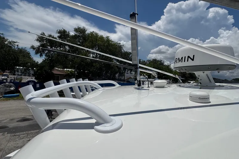 Slide: The Image of 2025 Intrepid 375 Nomad SE boat deck with Garmin radar under a cloudy sky. - 32