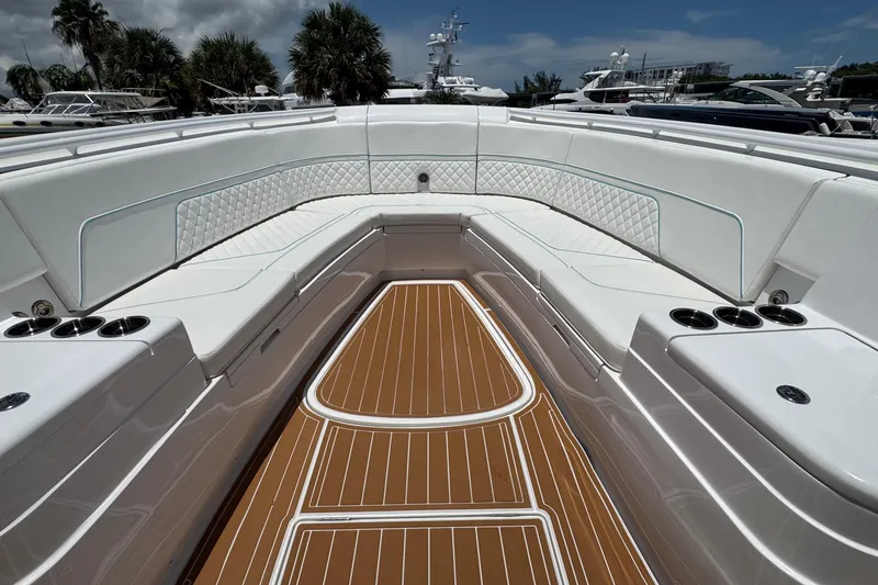 Slide: The Image of Luxurious seating area on 2025 Intrepid 375 Nomad SE boat with elegant wood flooring. - 7