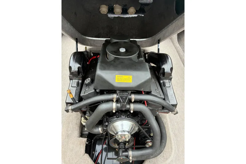 Slide: The Image of 1996 MasterCraft ProStar 190 engine compartment, showcasing detailed mechanical components. - 4