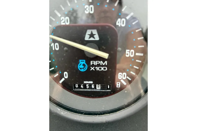 Slide: The Image of 1996 MasterCraft ProStar 190 tachometer showing 456.8 hours and RPM x100 gauge. - 3