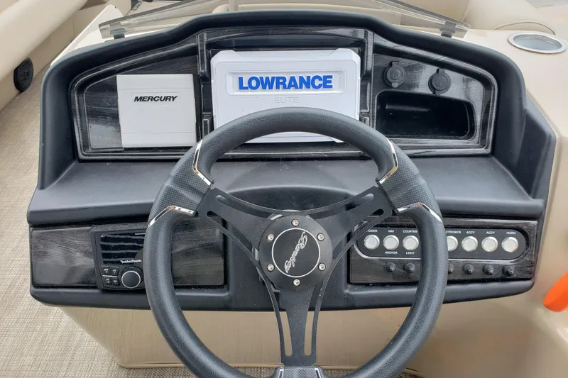 Slide: The Image of Steering console of 2023 Bentley Pontoons Elite 253 Admiral with Lowrance and Mercury displays. - 3