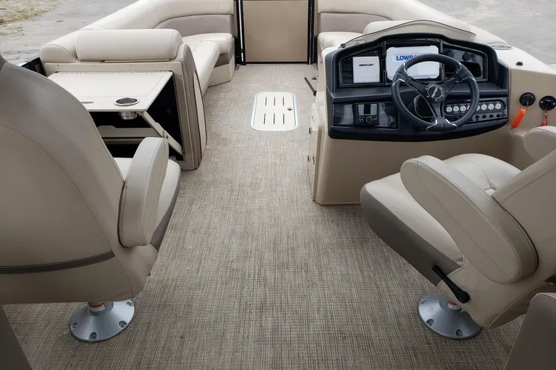 Slide: The Image of Interior of 2023 Bentley Pontoons Elite 253 Admiral, featuring helm and seating area. - 7