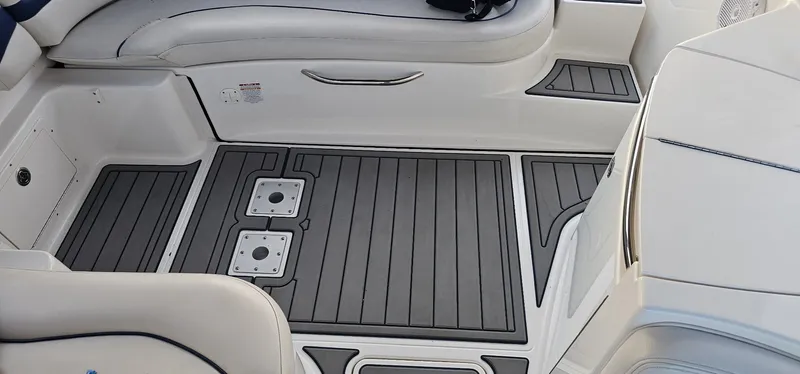 The Image of The image shows the interior of a 2003 Chaparral 285 SSi with gray flooring. - 0