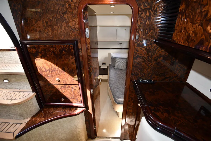 Slide: The Image of Luxurious interior of 1997 Sunseeker Camargue 51 yacht with wood finish and cozy cabin. - 46