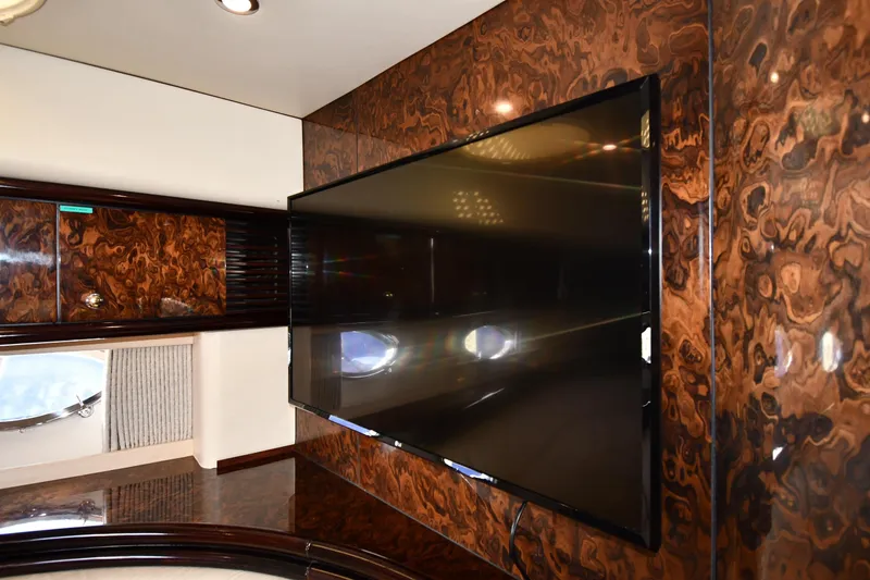 Slide: The Image of Luxurious interior of 1997 Sunseeker Camargue 51 yacht with wood paneling and flat-screen TV. - 50