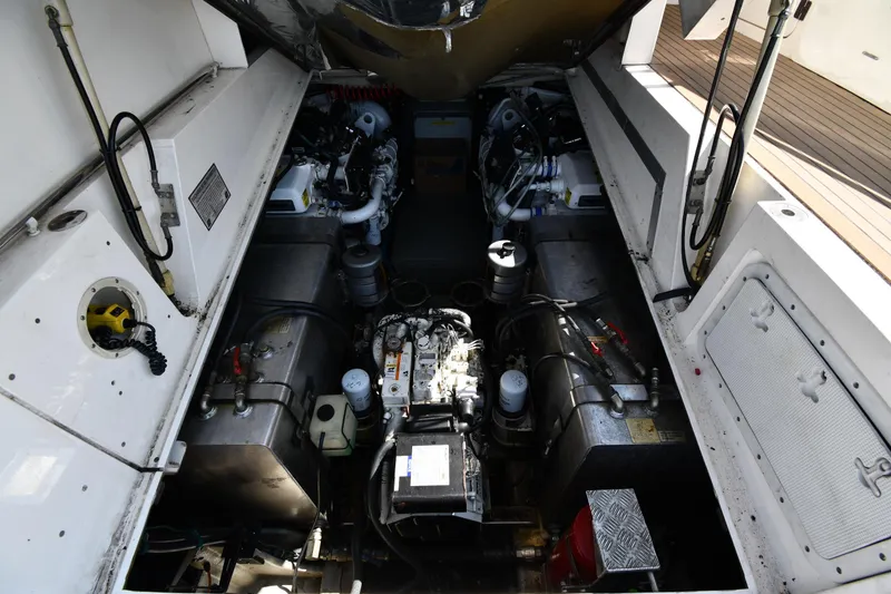 Slide: The Image of Engine compartment of a 1997 Sunseeker Camargue 51 yacht, showcasing mechanical components. - 59