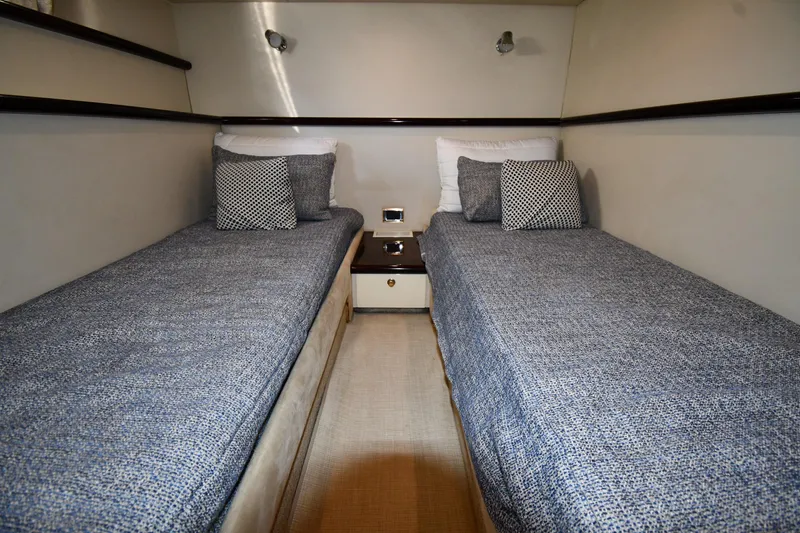 Slide: The Image of Twin beds in a 1997 Sunseeker Camargue 51 yacht cabin, featuring modern decor. - 45