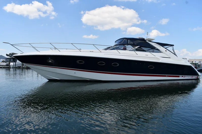 The Image of 1997 Sunseeker Camargue 51 yacht on calm water under blue sky. - 0