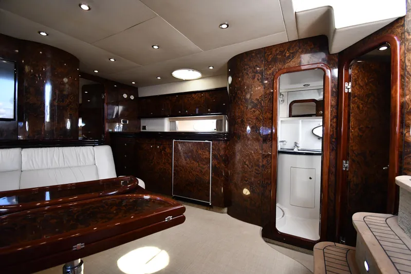 Slide: The Image of Luxurious interior of a 1997 Sunseeker Camargue 51 yacht with elegant wood finishes. - 35