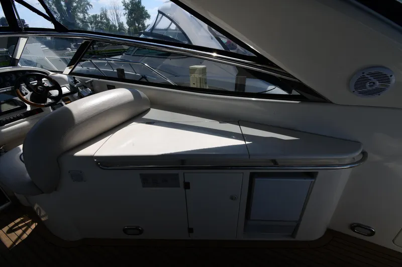 Slide: The Image of Interior view of 1997 Sunseeker Camargue 51 yacht cockpit with steering wheel and seating. - 23