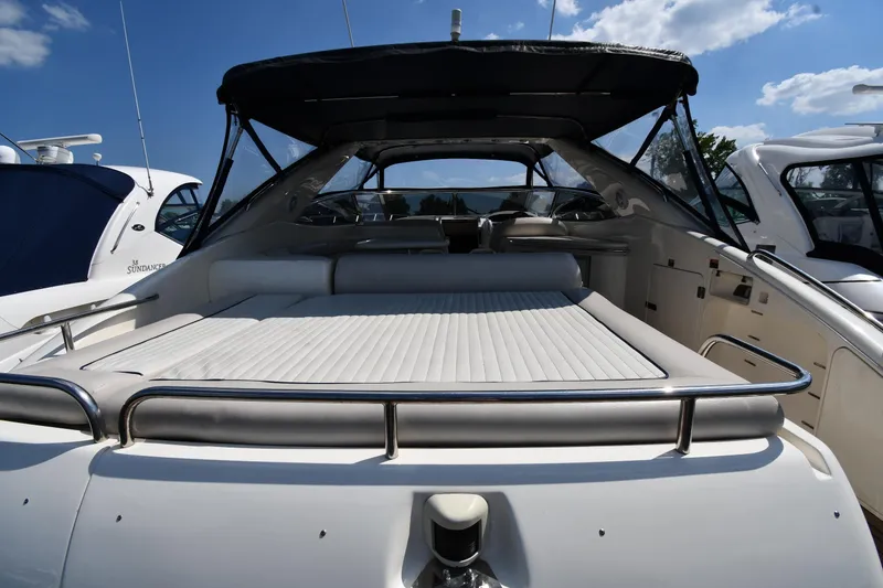 Slide: The Image of 1997 Sunseeker Camargue 51 yacht with spacious deck under clear blue sky. - 11