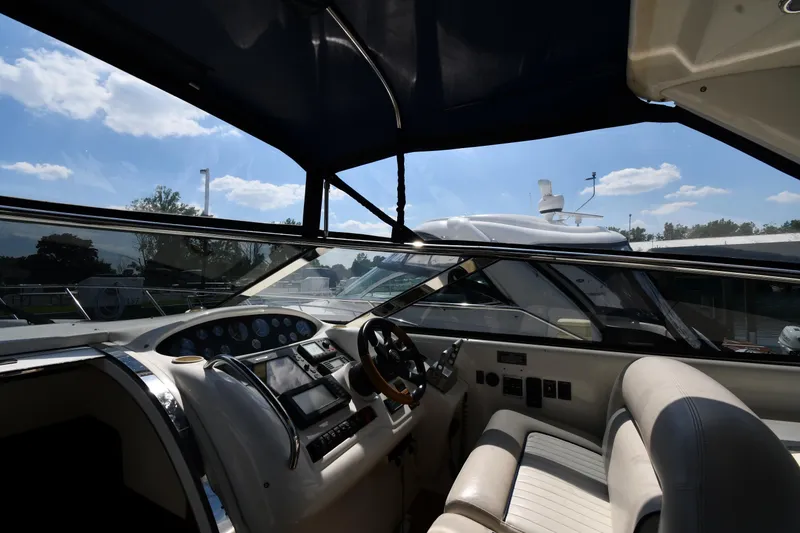 Slide: The Image of Interior view of 1997 Sunseeker Camargue 51 yacht cockpit with steering wheel and controls. - 13