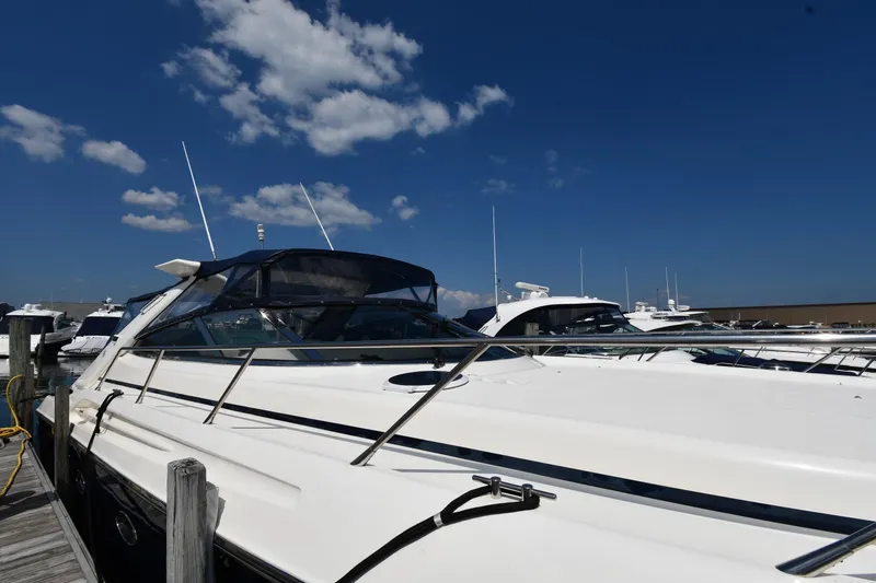 Slide: The Image of 1997 Sunseeker Camargue 51 yacht docked under clear blue sky. - 5