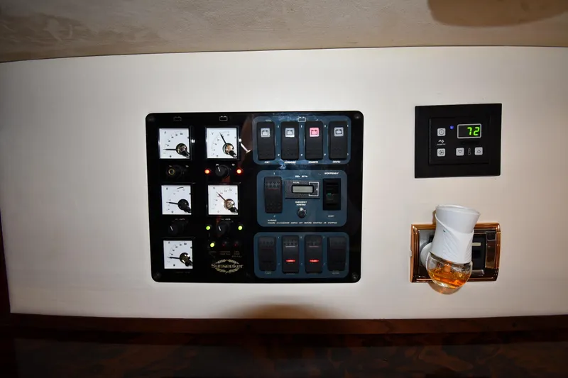Slide: The Image of Control panel of a 1997 Sunseeker Camargue 51 yacht with gauges and thermostat. - 49