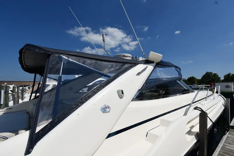 Slide: The Image of 1997 Sunseeker Camargue 51 yacht docked under clear blue sky. - 6
