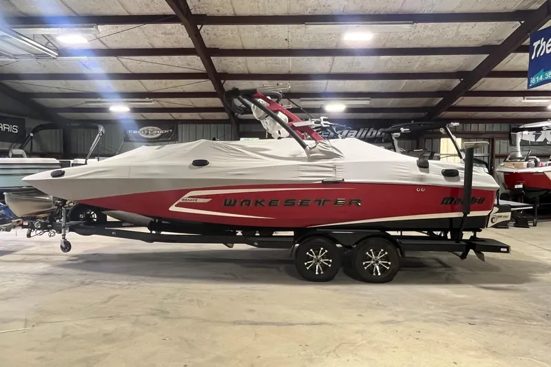 Slide: The Image of 2015 Malibu Wakesetter 24 MXZ boat in storage, covered and on a trailer. - 4
