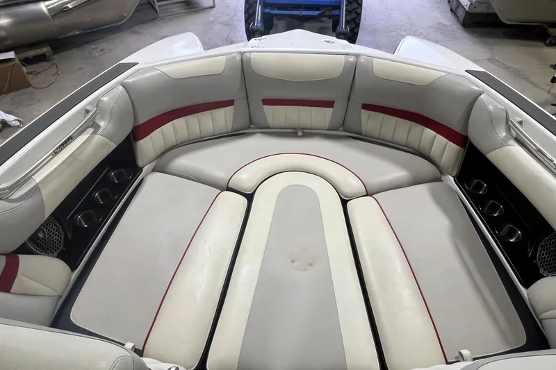 Slide: The Image of Interior of 2015 Malibu Wakesetter 24 MXZ boat with white and red seating. - 7