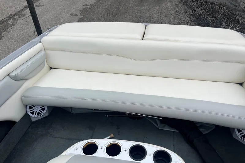 Slide: The Image of 2004 MasterCraft X-9 boat interior with white seating and cup holders. - 9
