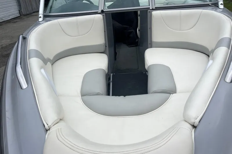 Slide: The Image of 2004 MasterCraft X-9 boat interior with white and gray seating. - 11