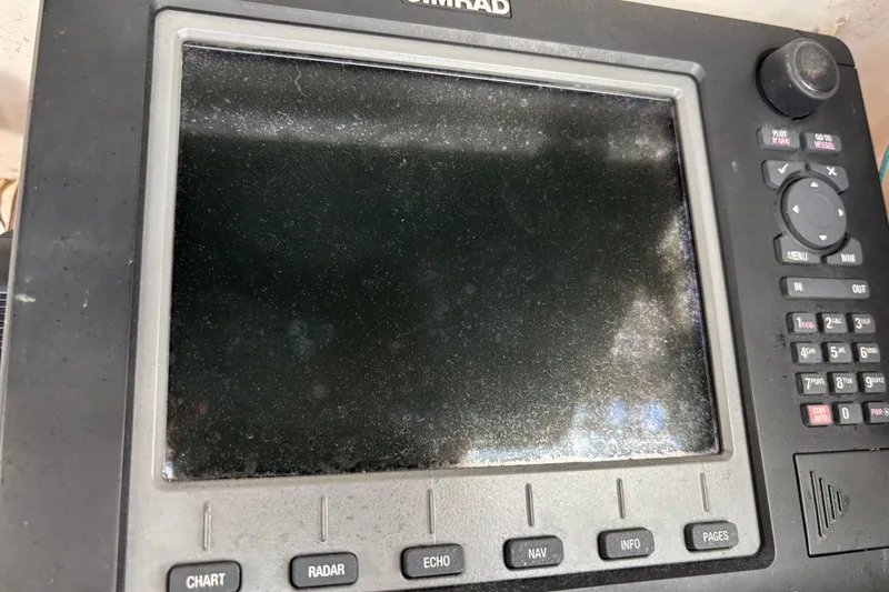 Slide: The Image of Simrad marine navigation system on a 1979 Trojan F-36 Convertible boat. - 9