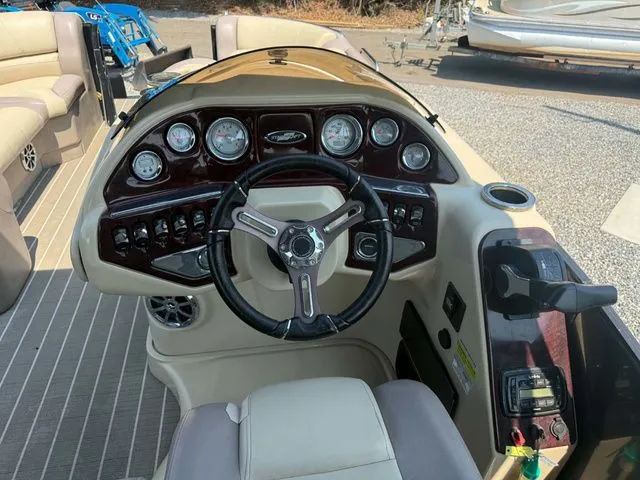 Slide: The Image of Helm of a 2017 Starcraft MX 23 C with steering wheel and gauges. - 10