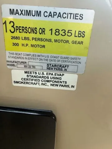 Slide: The Image of Capacity label: 13 persons or 1835 lbs. Manufacturer: Starcraft, Model: MX 23 C. - 19