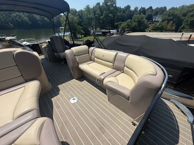 Slide: The Image of The image shows the deck of a 2017 Starcraft MX 23 C with beige seating. - 20