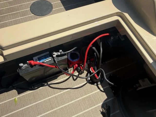 Slide: The Image of Battery and wiring in a boat, mounted on a textured floor. - 14