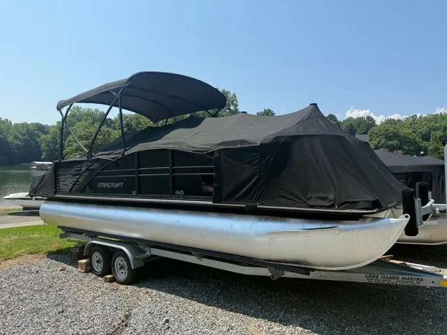 Slide: The Image of 2017 Starcraft MX 23 C pontoon boat on a trailer. - 5