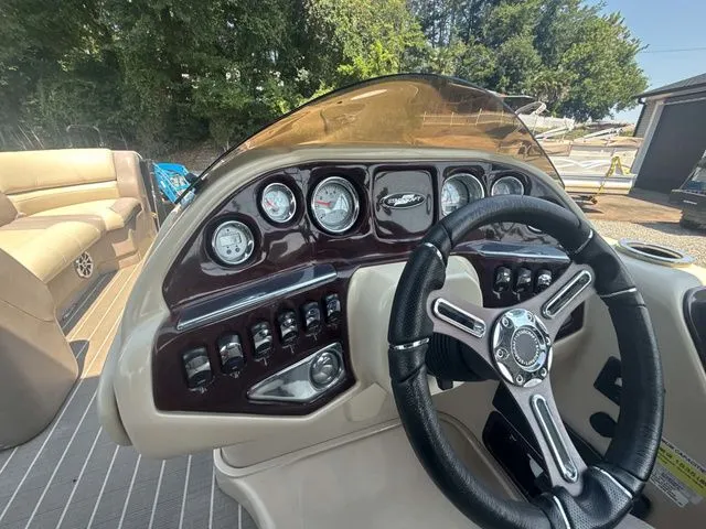 Slide: The Image of The image shows the cockpit of a 2017 Starcraft MX 23 C with a sleek steering wheel and gauges. - 12