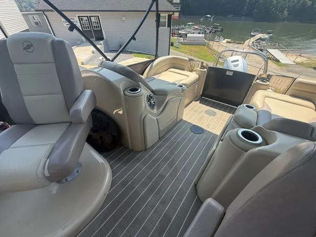 Slide: The Image of Interior of a 2017 Starcraft MX 23 C with beige seating and gray flooring. - 22
