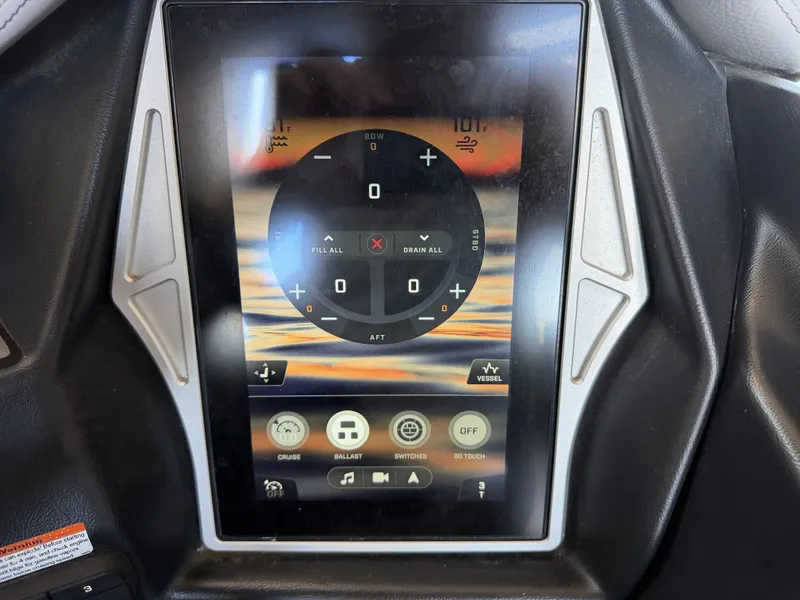 Slide: The Image of The image shows a modern boat control panel with a digital display. - 35