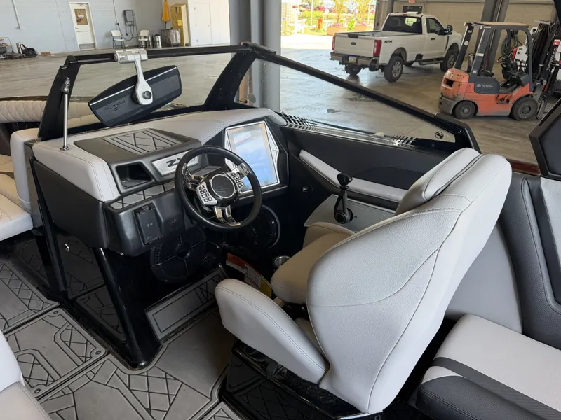 Slide: The Image of Interior view of a modern boat with a sleek helm and large display screen. - 27