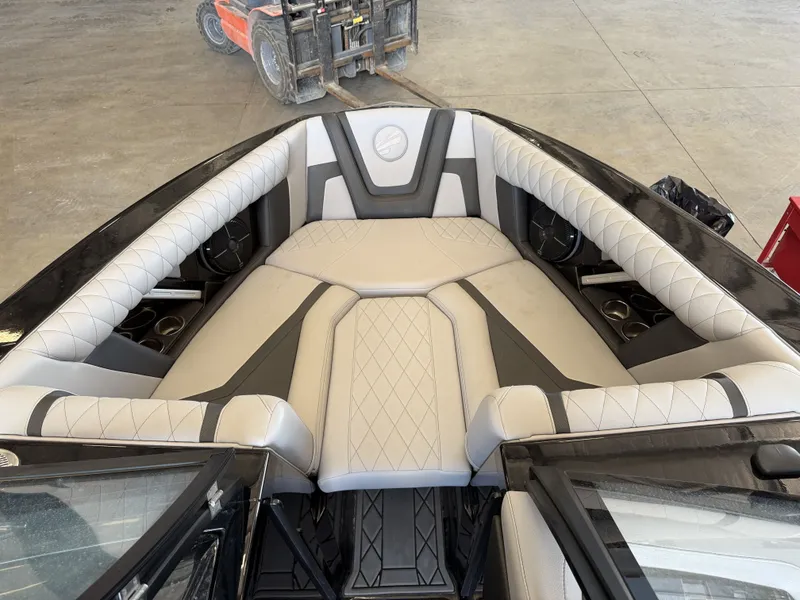 Slide: The Image of The image shows the interior of a 2021 Tigé 23ZX boat with luxurious seating. - 38