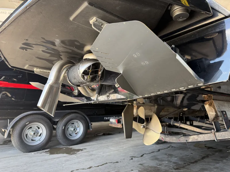Slide: The Image of Close-up of the drive and propeller of a Tigé 23ZX boat on a trailer. - 12