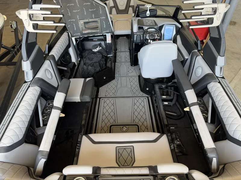 Slide: The Image of Interior of a 2021 Tigé 23ZX with luxurious seating and a modern dashboard. - 22