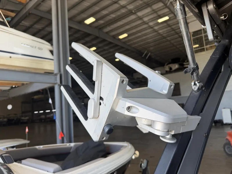 Slide: The Image of A boat in a warehouse with a modern wakeboard rack. - 42