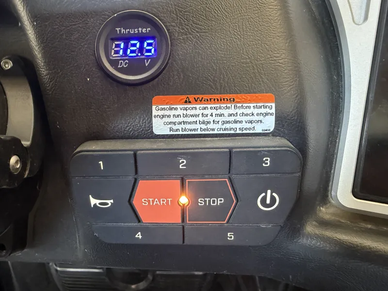 Slide: The Image of Dashboard of a Tigé 23ZX with control buttons and a warning label. - 34