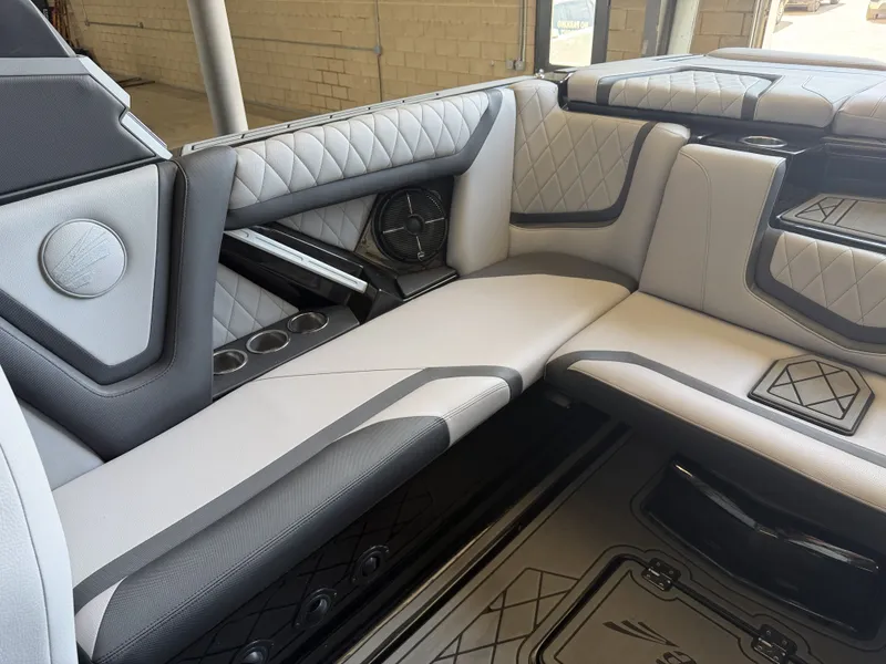 Slide: The Image of Interior of a 2021 Tigé 23ZX with sleek, upholstered seating and modern speakers. - 21