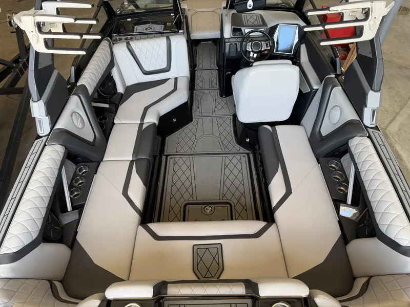 Slide: The Image of Interior of a 2021 Tigé 23ZX with luxurious padded seating and a modern dashboard. - 19