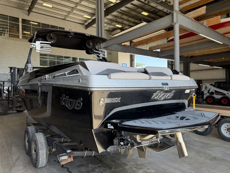 Slide: The Image of A 2021 Tigé 23ZX boat in a warehouse setting. - 8