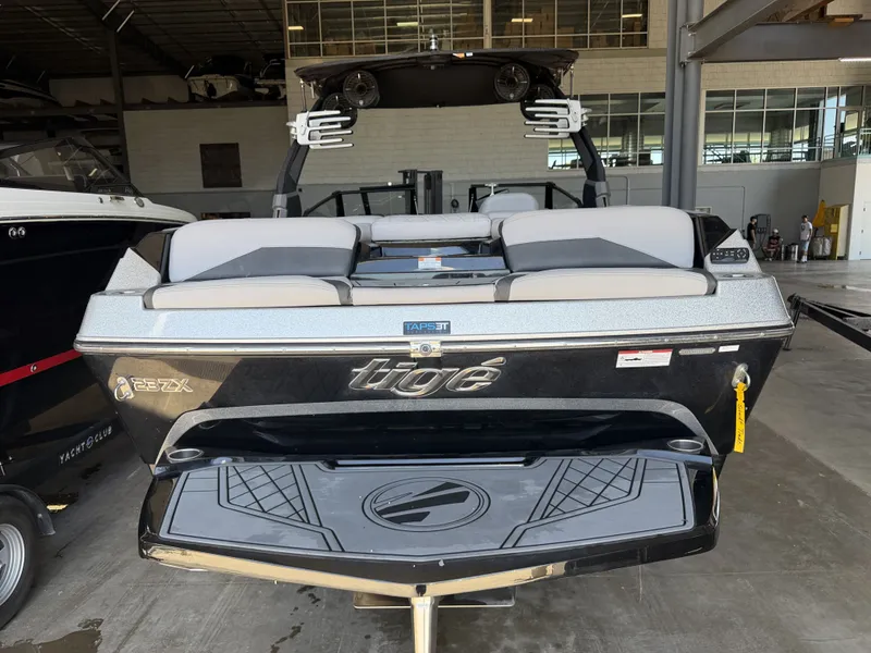 Slide: The Image of The image shows a 2021 Tigé 23ZX boat in a warehouse. - 13